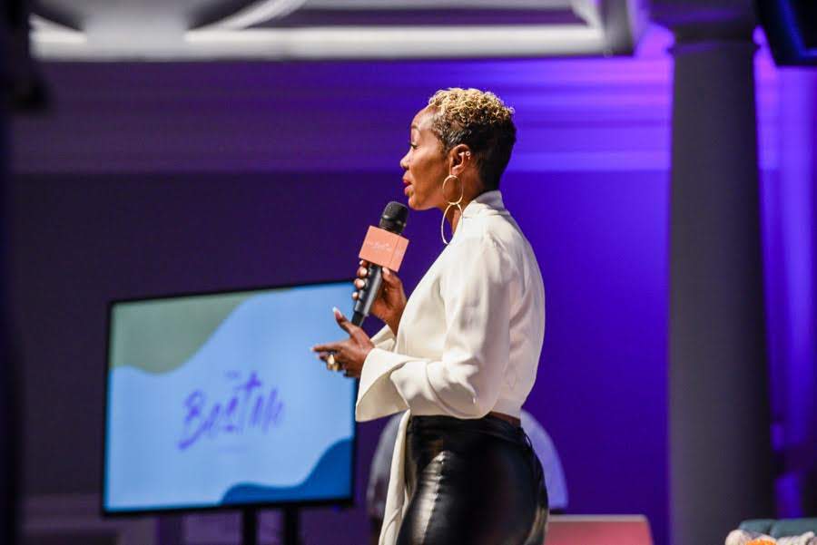 Speaking on the stage at The Best Me Conference